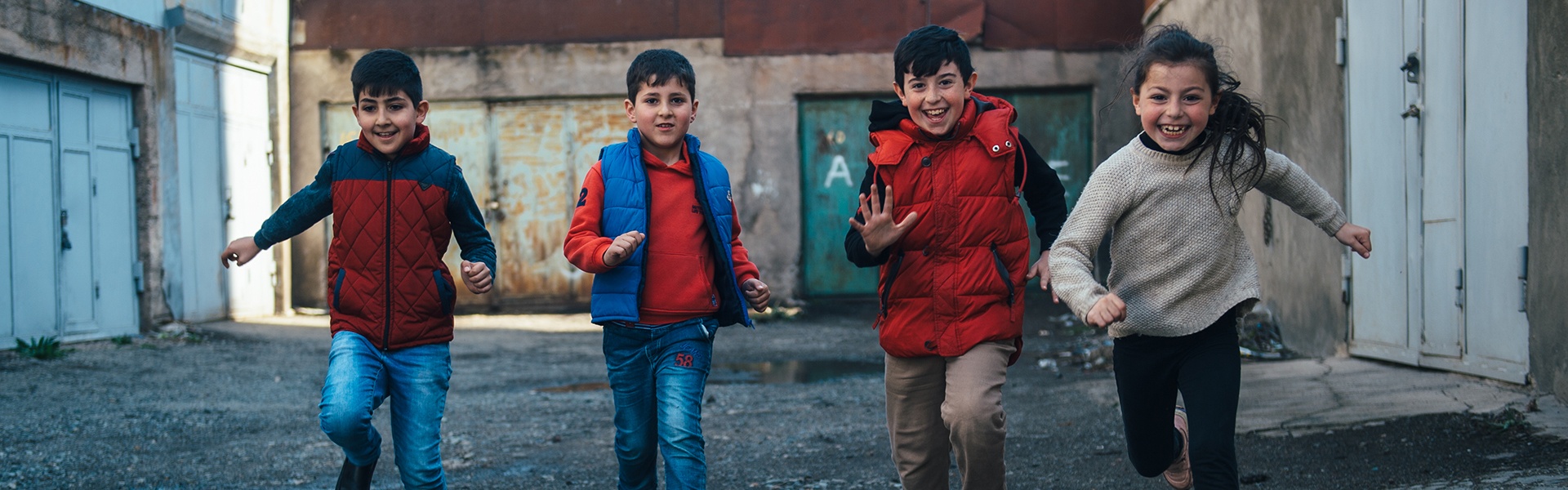 Children Running In Backstreet Near Sevan Baptist Church.