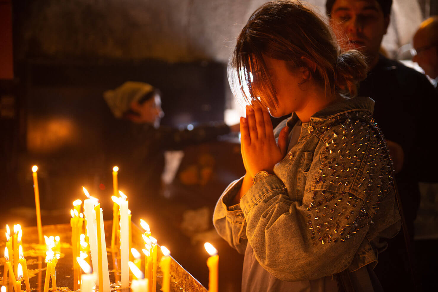 A woman prays in a church in Armenia.