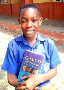 Ghana boy holding a book
