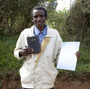 Enoce With His Bible And Certificate