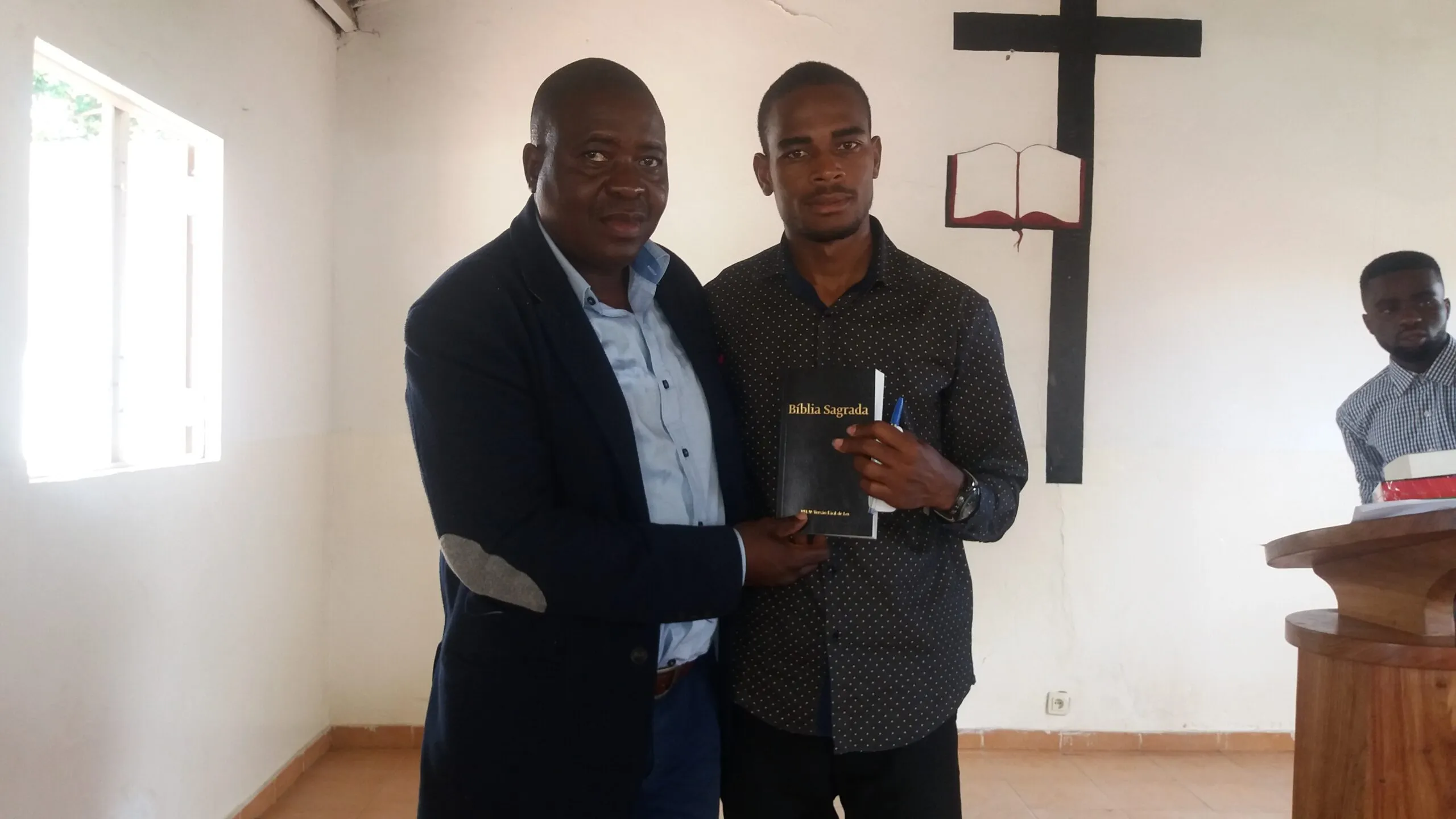 a man holding the bible. from BLI